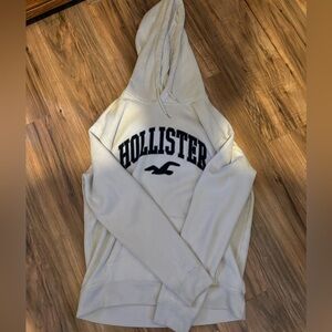 Size medium men’s Hollister Hoodie in white with dark blue big logo